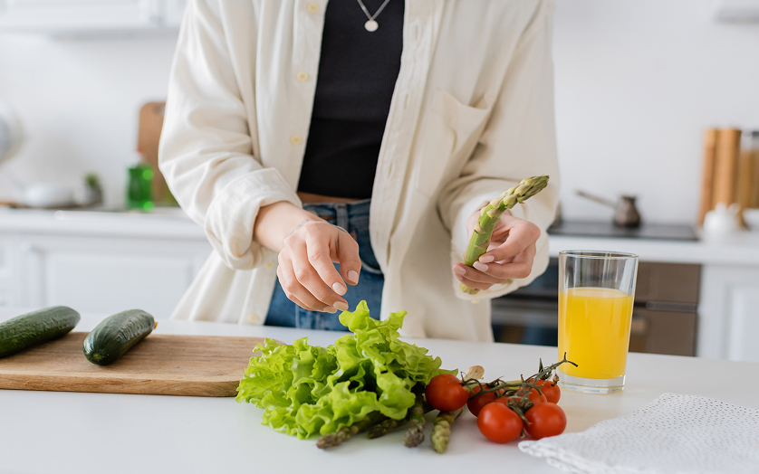 Woman cooking with vegetables